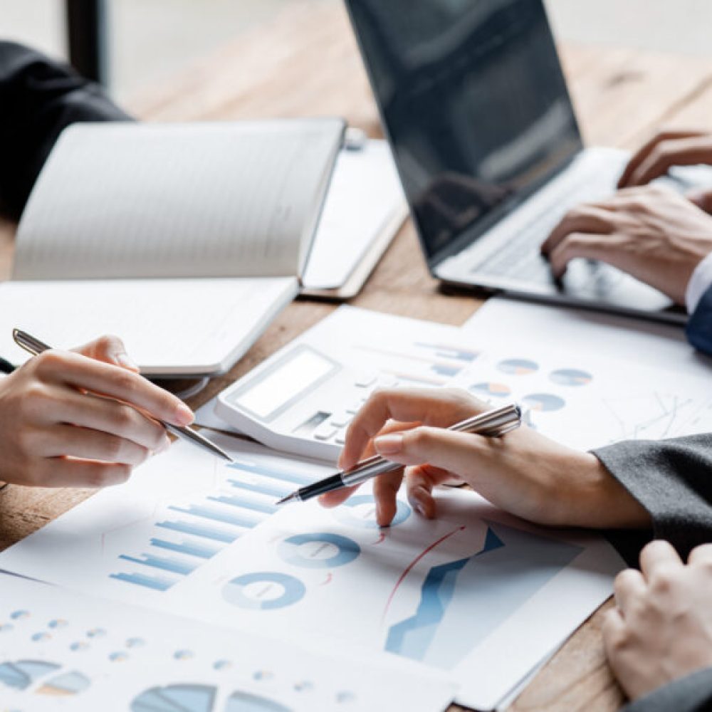 Asian business man are meeting to summarize the company's operating, financial, profit and loss results. Management of startup companies. Profitable management concept and growing management.